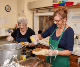 Catholics helping serve food